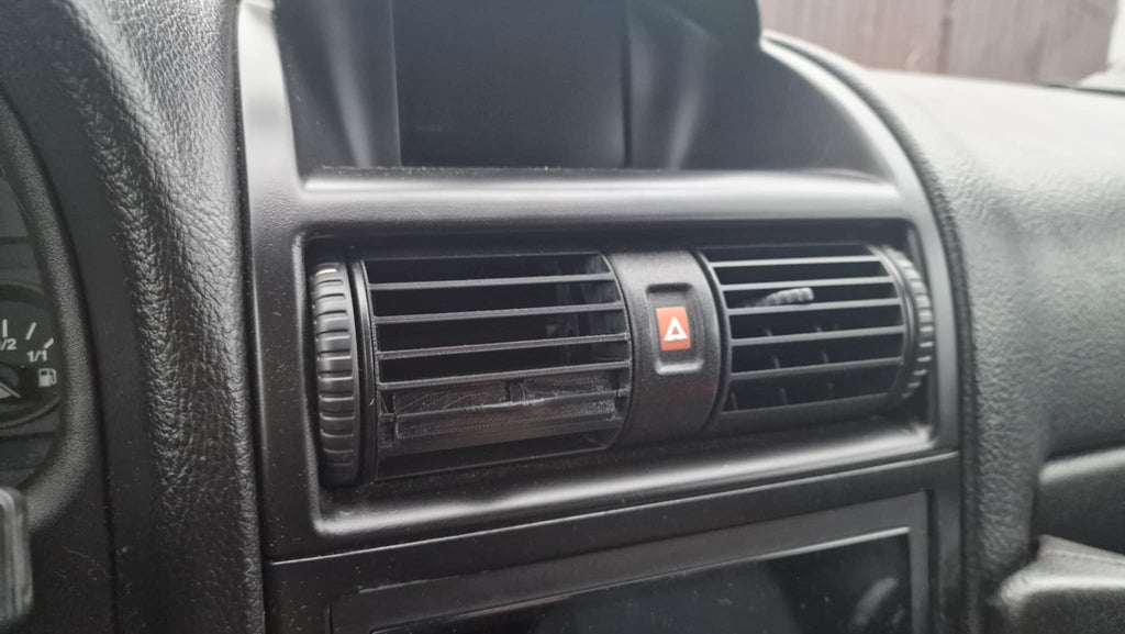 Opel Astra G pohártartó szellőző rácsba