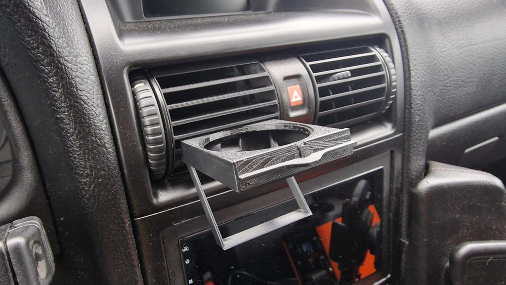 Opel Astra G pohártartó szellőző rácsba